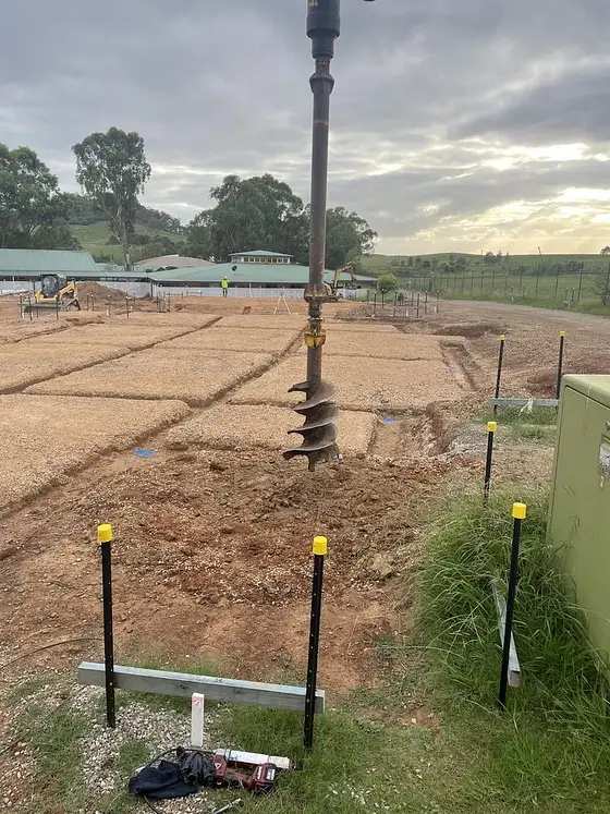 Bored piers being drilled